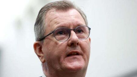 Donaldson says he will not ‘bow to threats’ amid warning of loyalist protests