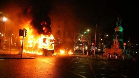 Shops looted, Luas and Dublin Bus set alight as 'hooligans' clash with gardaí
