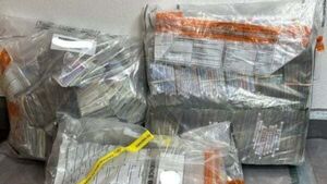 Cash and drugs worth €400,000 recovered from car in Co Down Cash and drugs worth €400,000 recovered from car in Co Down