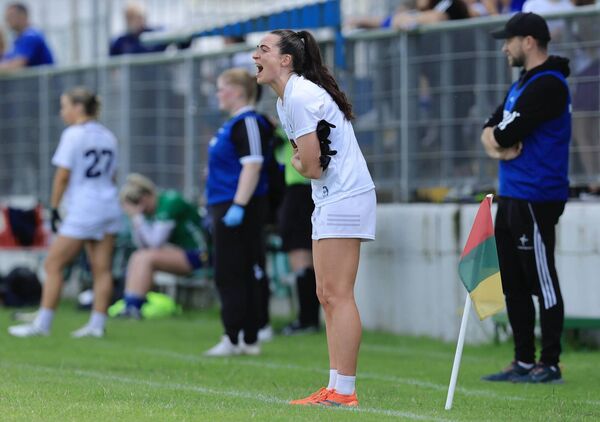 Team captain Grace Clifford urges the team on from the sideline