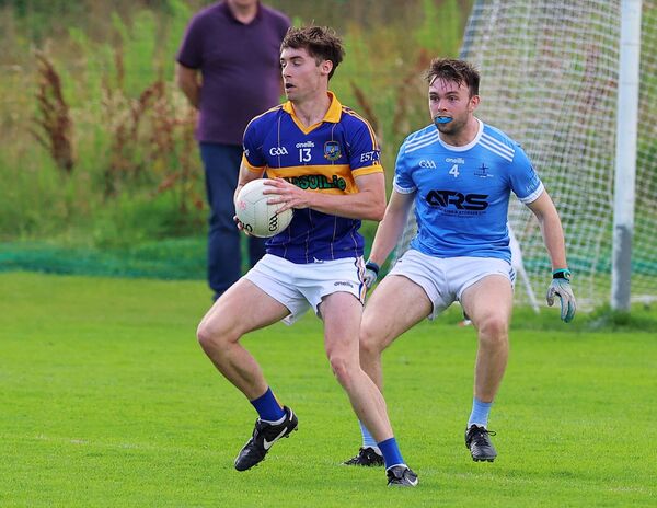 Grangenolvin's Oran Bergin wins the ball in front of Athgarvan's Conor Cummins