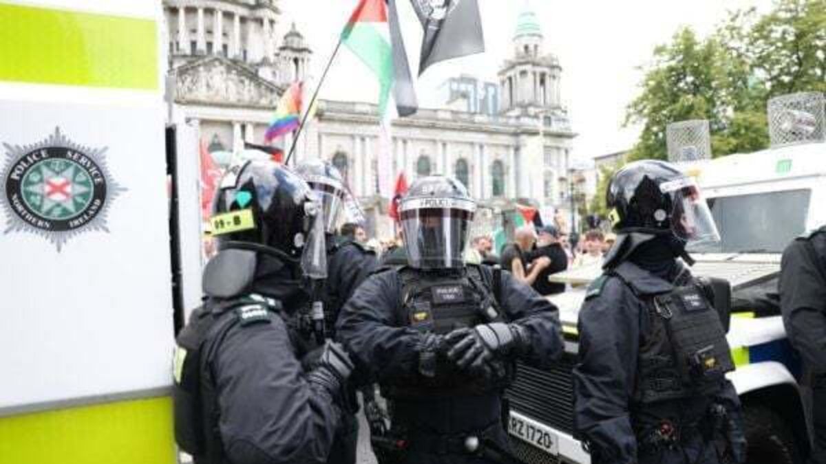 Violent clashes and businesses attacked amid anti-immigration protest in Belfast