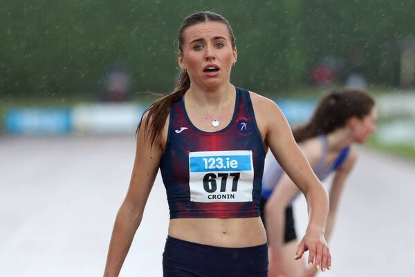 Caoimhe Cronin (Le Cheile) wins the 200m heat amid atrocious conditions Photo: Perri Williams