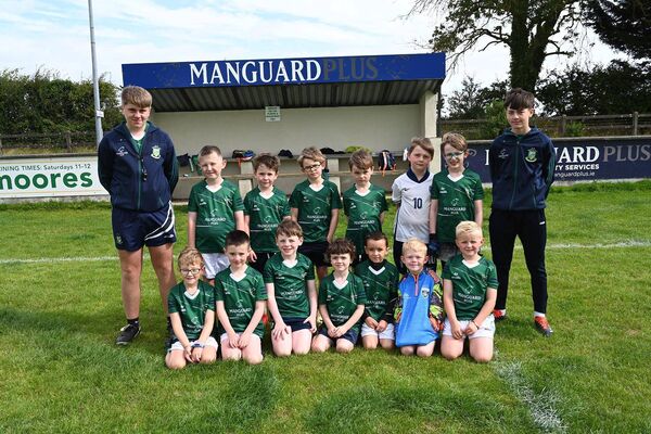 U8 boys and their coaches Ross Courtney and Jamie Wolfe 
