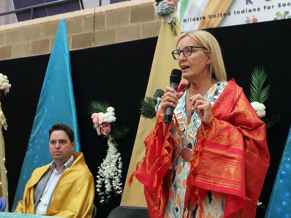 Mayor of the Kildare-Newbridge MD Cllr Peggy O'Dwyer speaking at the Indian event in Kilcullen, with Minister Martin Heydon