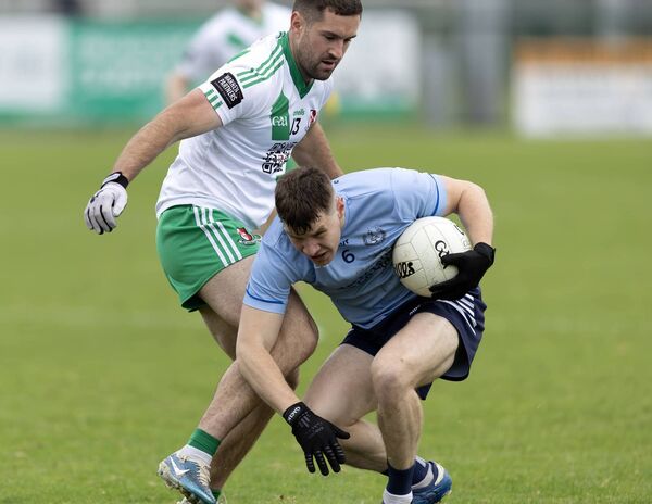 Eadestown's Jack Sargent is tackled by Sarsfields' Ben McCormack Photo: Sean Brilly
