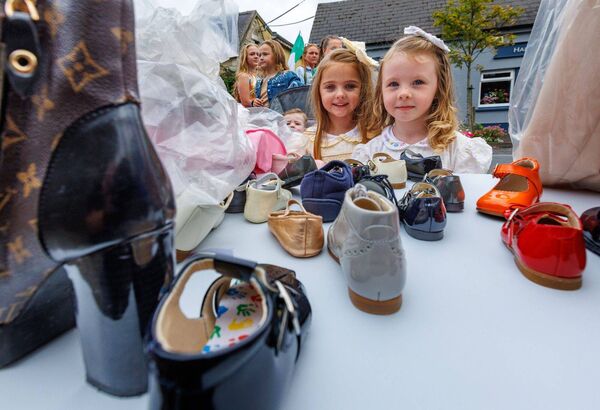 Sisters Katie and Debbie check out the shoes at the Borris Fair