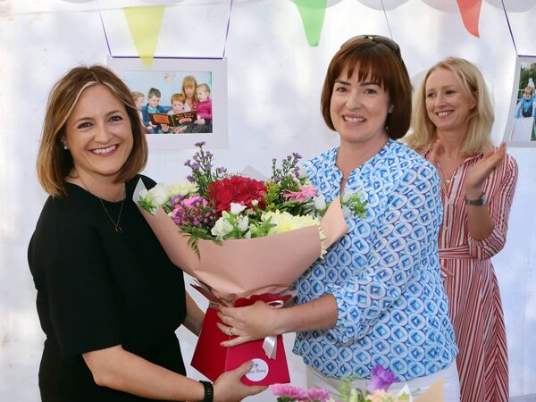 Sinead Forde of the Community Playgroup BOM (right) presents a bouquet to Emma McEvoy, Manager of KCCEC.
