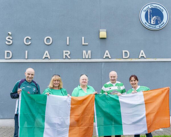 Eoin Kirk, Angela Smyth, Deborah and Ken Shorten and Deirdre Harris proudly flying the Irish flag at the Castledermot school