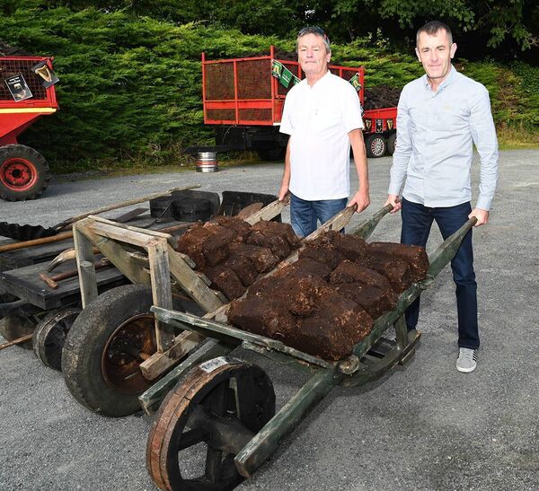 Mick Cullinane and Paul McCaughey bringing home the turf