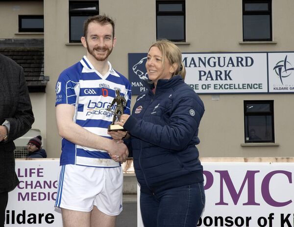Conor Donnelly is presented the man of the match award by County Board PRO Lorraine Woulfe after scoring 1-9 in the game Conor Donnelly is presented the man of the match award by County Board PRO Lorraine Woulfe after scoring 1-9 in the game