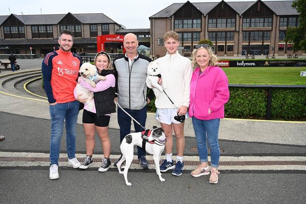 Brenden Rice, Olivia, Simon, Aron and Olive Kraus and their dogs Benny, Binky and Fluffy