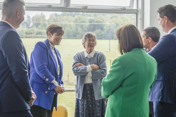 Sister Angela chats with the Minister and representatives
