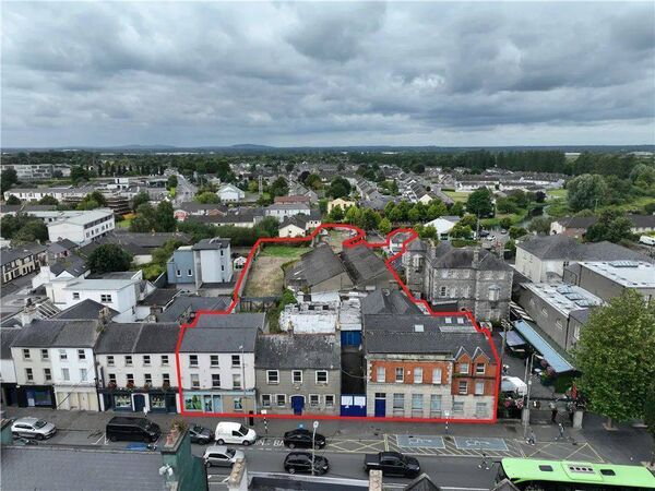 The buildings comprise of the former Leinster Leader office &amp; Printing Works, two storey adjacent house (fronting the Main Street), a substantial three storey retail/ residential building (Gogarty's) and a two Storey residence fronting The Canal Harbour (The Yellow House) 
