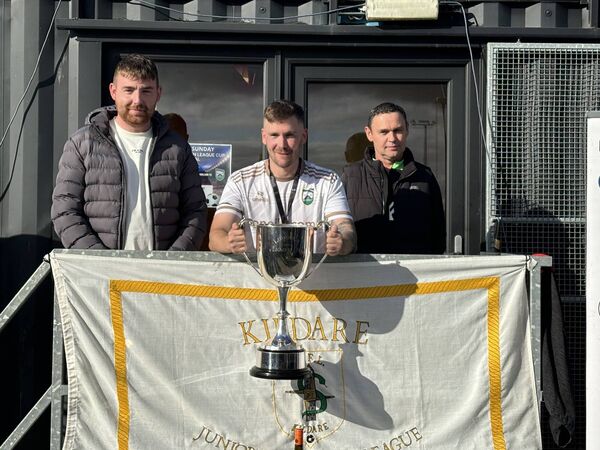 Clonmullion captain Nathan Robinson is presented with the Lumsden Cup with members of the Lumsden family Clonmullion captain Nathan Robinson is presented with the Lumsden Cup with members of the Lumsden family
