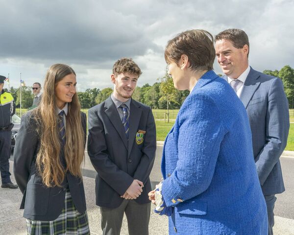 Head Girl Aoibhe Lovern and Head Boy Michael Baker welcome Minister Norma Foley