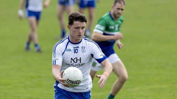 Naas pull away in final quarter to book semi-final spot