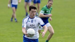 Naas pull away in final quarter to book semi-final spot