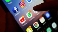 Taoiseach accuses Sinn Féin of ‘hypocrisy’ over opposition to phone pouch scheme