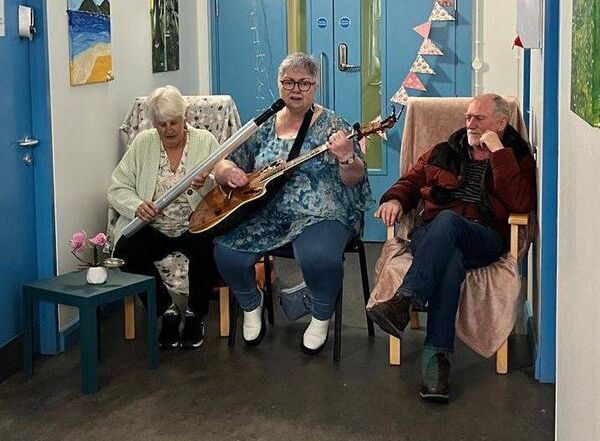 Ann Walker singing wtih Joe O'Connor and Carmel O'Connor at the display