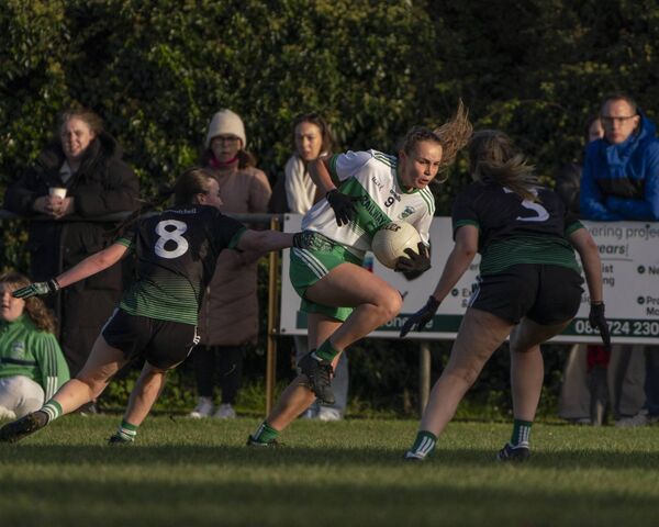 Sallins' Lia Reilly under pressure from Castlemitchell's Amy O'Brien and Laoise Langton Photo: Aisling Hyland