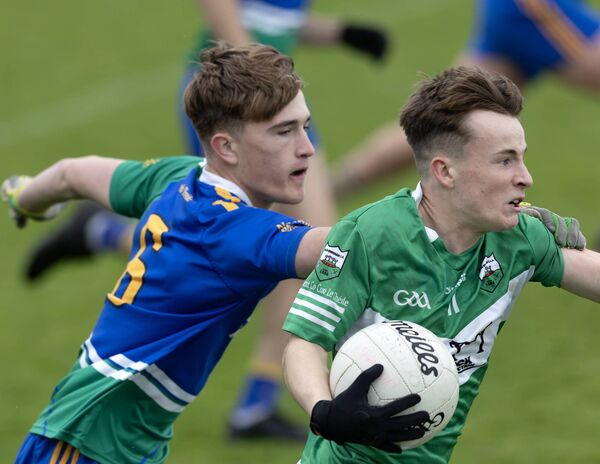 Rathangan's Austin Donegan goes past Naomh Bhride's Charlie Cullen Photo: Sean Brilly Rathangan's Austin Donegan goes past Naomh Bhride's Charlie Cullen Photo: Sean Brilly