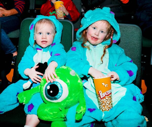 Éabha Clarke and Aislinn Clarke watching Monsters Inc at Barretstown Halloween event 