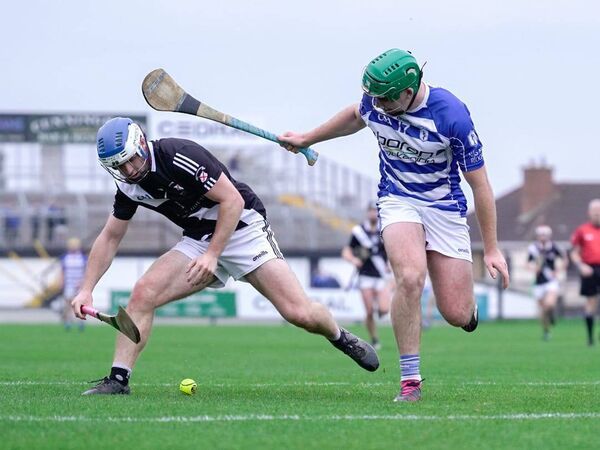 Naas' Liam Walsh and Maynooth's Dan O'Meara Photo: Aisling Hyland