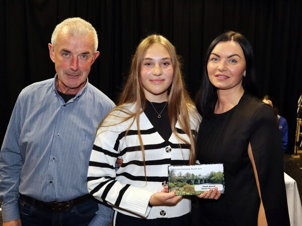 Vaneska Mojzesova accepting her Youth Award from KCA's Martin Sheridan, with her coach Elma Darcy.