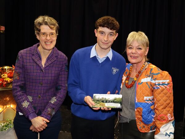 Sarah Gillespie and Katy Palmeiri accepting their Best Community Arts award from TY student Sean Hoey.