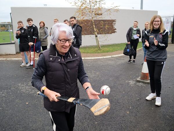 Betty Lambe finishing her hurling solothon run in accomplished style.