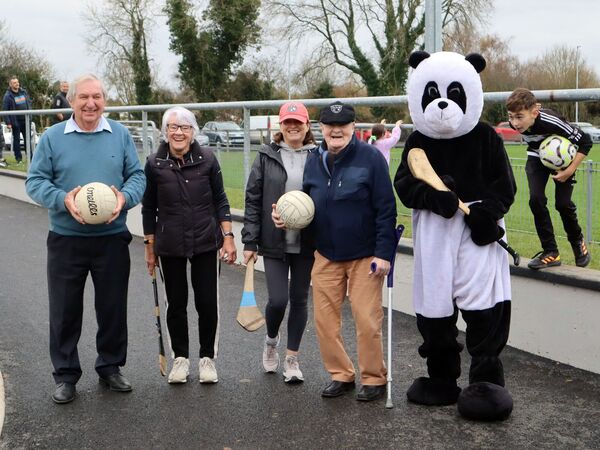 John O'Brien and the club's mascot Raggie accompanied Betty and Michael Lambe on their solothon.
