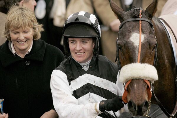 Jessica Harrington with jockey Barry Geraghty and Moscow Flyer after winning the Champion Chase at the 2005 Cheltenham Festival Photo: ©INPHO/Morgan Treacy Jessica Harrington with jockey Barry Geraghty and Moscow Flyer after winning the Champion Chase at the 2005 Cheltenham Festival Photo: ©INPHO/Morgan Treacy