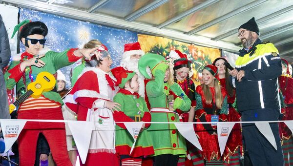 Garda Sean O'Mahoney on stage with Santa Clause, Mrs Clause and the elves Garda Sean O'Mahoney on stage with Santa Clause, Mrs Clause and the elves