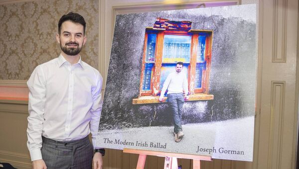 Joseph Byrne with the cover art of his latest release