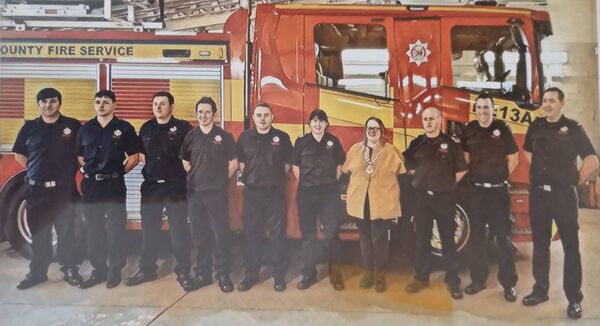 Robert Deegan, second from left, poses with his colleagues during his time at the Athy Fire Station