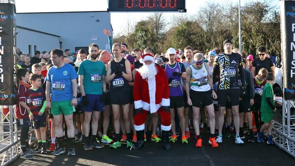 Santa posed with the serious runners waiting for the start Santa posed with the serious runners waiting for the start