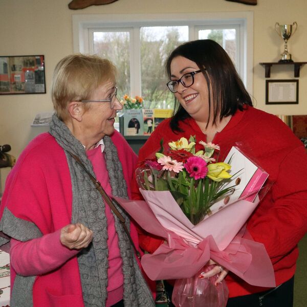 Nessa Dunlea presents a bouquet to Anne Bolger