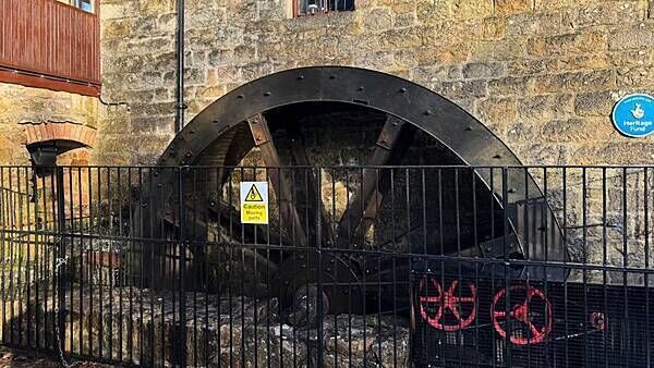 Water wheel starts turning again to power restaurant at historic mill