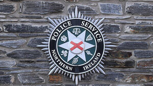 Police remove racially-motivated signs from outside primary school in Co Armagh Police remove racially-motivated signs from outside primary school in Co Armagh