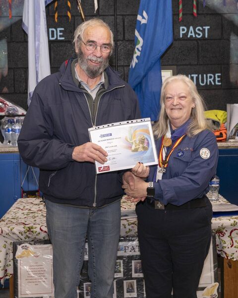 Mary Fricker presents Jim Lawler with his 35 years service award