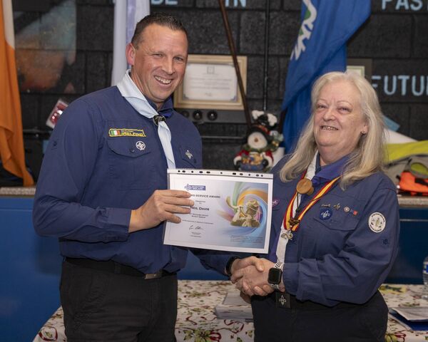 Mary Fricker presents Neil Davis with his service award