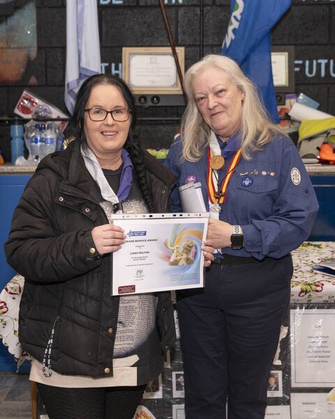 Mary Fricker presents Linda Dalton with her service award