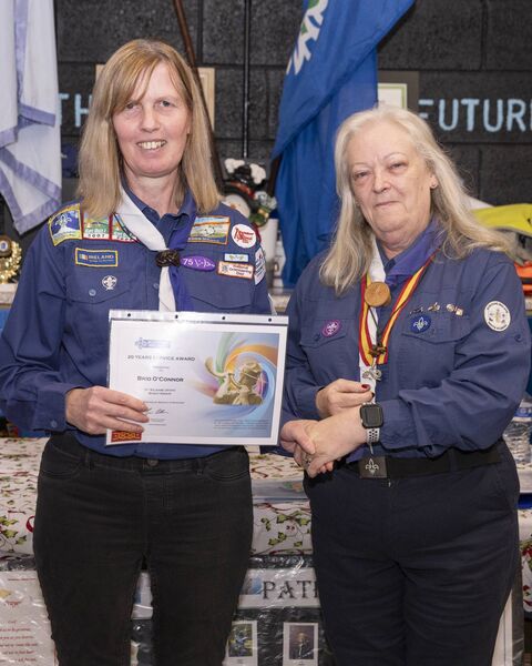 Mary Fricker presents Brid O'Connor with her 20 years service award