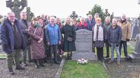 Family erect gravestone on unmarked Athy grave 