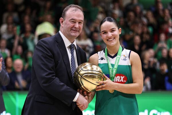 Basketball Ireland CEO John Feehan presents the MVP Award to Hazel Finn of FloMAX Liffey Celtics Photo: ©INPHO/Ben Brady