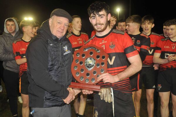Con Ronan (Leinster Schools GAA_ Presents the trophy to Tadhg Donlon ( Kildare Town Community School captain) Photo: Martin Rowe 