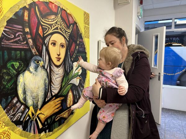 Baby Rose and Kate Deering with the Beauty of Brigid painting (inspired by William Earley stained glass studios), Arthouse Athy 