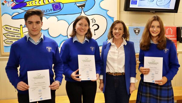 With their MaMUN certificates, Sam Moussoulides, Aoibhe Toft and Eleanor Steed and teacher Mary Quinto