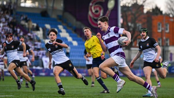 Victor Lamph of Clongowes Wood College on his way to scoring a try Photo: Shauna Clinton/Sportsfile 